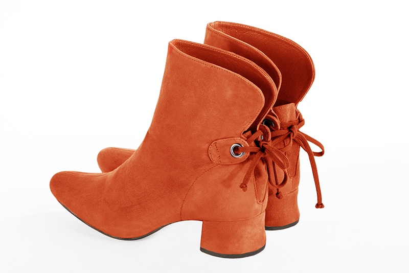 Clementine orange women's ankle boots with laces at the back. Round toe. Low flare heels. Rear view - Florence KOOIJMAN